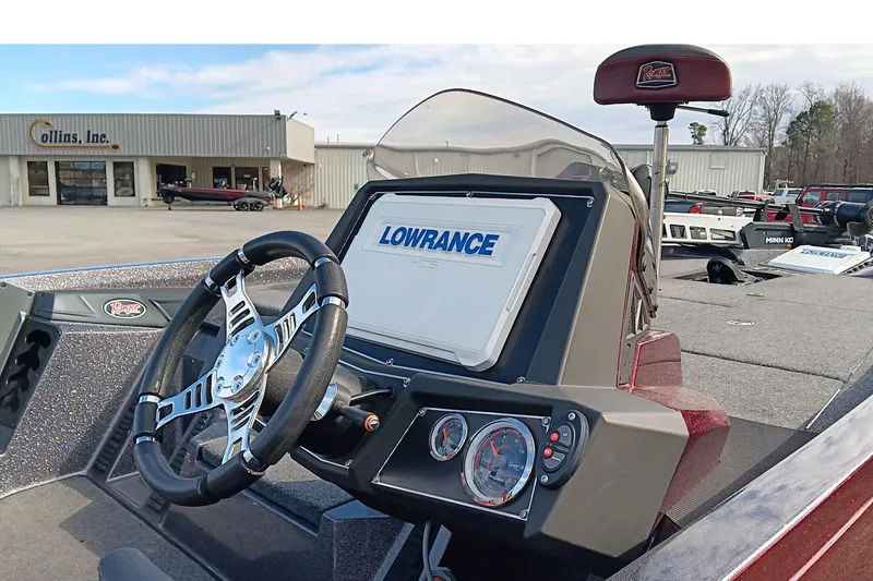 Slide: The Image of 2020 Ranger Z519 boat dashboard with Lowrance display and steering wheel at dealership. - 14