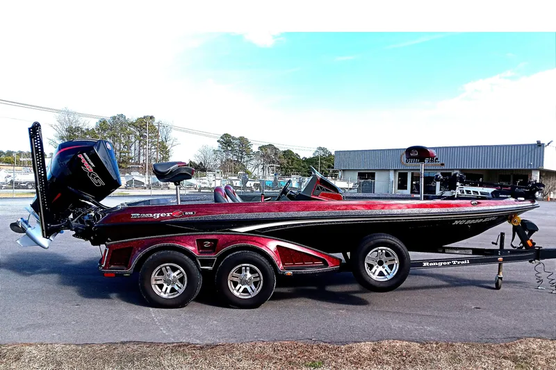 Slide: The Image of 2020 Ranger Z519 boat with trailer, parked outdoors near a building. - 6