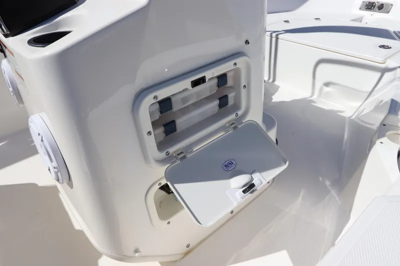 Slide: The Image of 2020 Boston Whaler 150 Montauk boat interior with open storage compartment. - 10