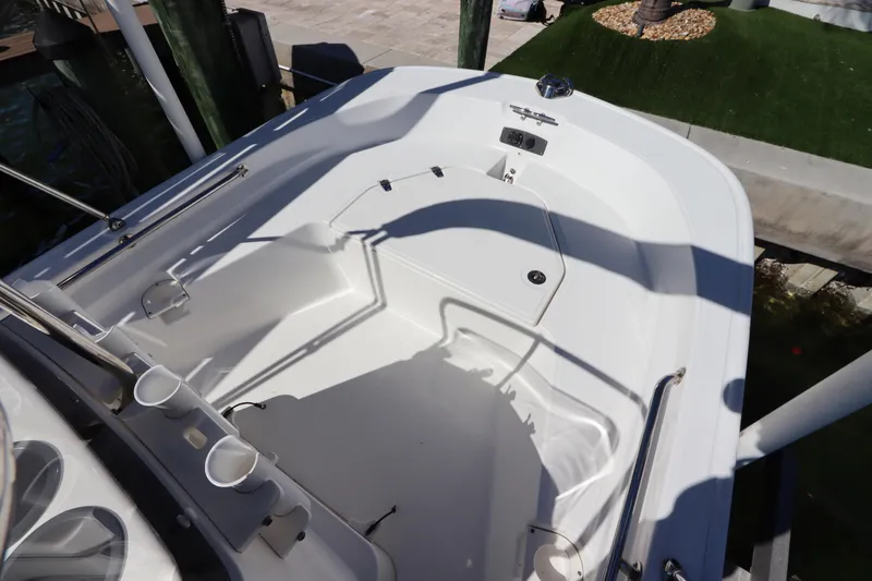 Slide: The Image of 2020 Boston Whaler 150 Montauk boat interior with seating and storage. - 11