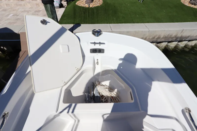 Slide: The Image of Open storage compartment on a 2020 Boston Whaler 150 Montauk boat. - 12