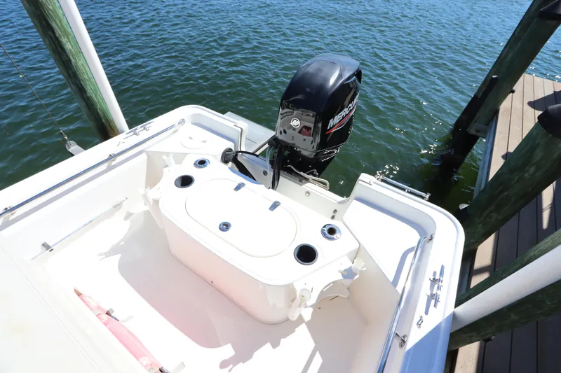 Slide: The Image of 2020 Boston Whaler 150 Montauk boat with Mercury engine at dock. - 3