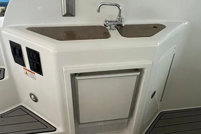 Slide: The Image of 2008 Cruisers Yachts 390 Sports Coupe kitchenette with sink and storage. - 19