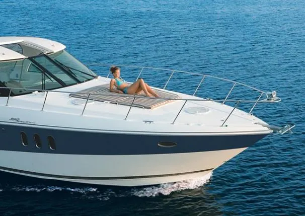 Slide: The Image of Woman relaxing on 2008 Cruisers Yachts 390 Sports Coupe at sea. - 3