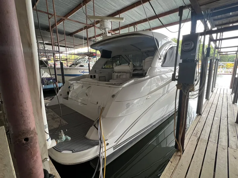 Slide: The Image of 2008 Cruisers Yachts 390 Sports Coupe docked in a covered marina. - 10