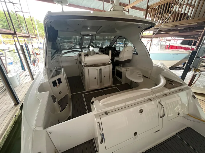Slide: The Image of 2008 Cruisers Yachts 390 Sports Coupe interior view, featuring helm and seating area. - 11