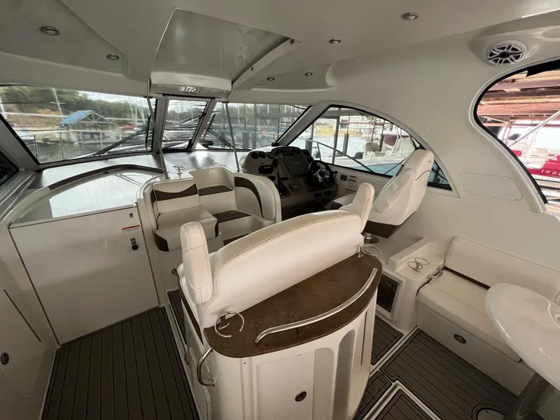 Slide: The Image of 2008 Cruisers Yachts 390 Sports Coupe interior with helm, seating, and panoramic windows. - 12