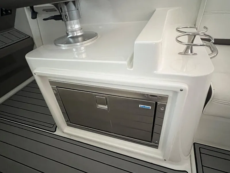 Slide: The Image of 2008 Cruisers Yachts 390 Sports Coupe interior with built-in stainless steel refrigerator and cup holders. - 13