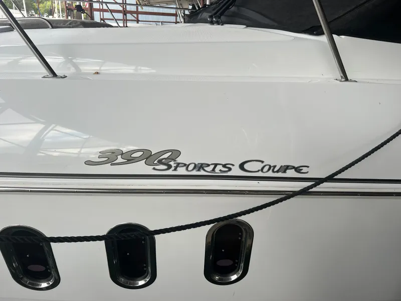 Slide: The Image of 2008 Cruisers Yachts 390 Sports Coupe, white exterior with logo, docked. - 16