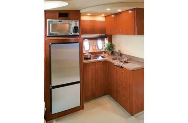 Slide: The Image of Kitchen area of the 2008 Cruisers Yachts 390 Sports Coupe. - 7