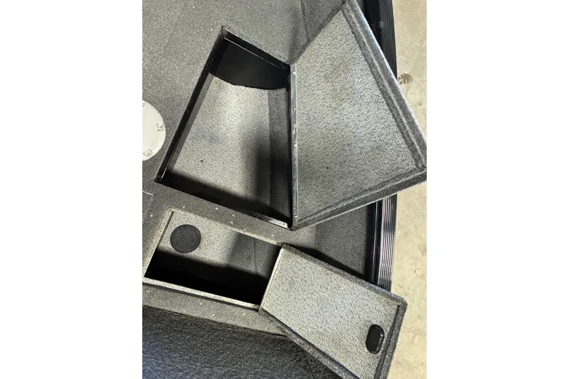 Slide: The Image of Open storage compartments on a 2017 Lund 1750 Rebel XS Sport boat. - 14