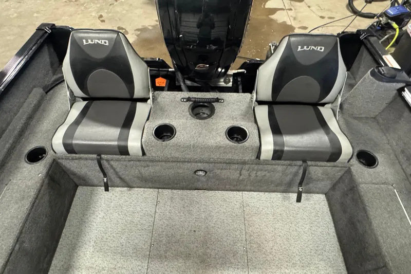 Slide: The Image of 2017 Lund 1750 Rebel XS Sport boat interior with two seats and cup holders. - 6
