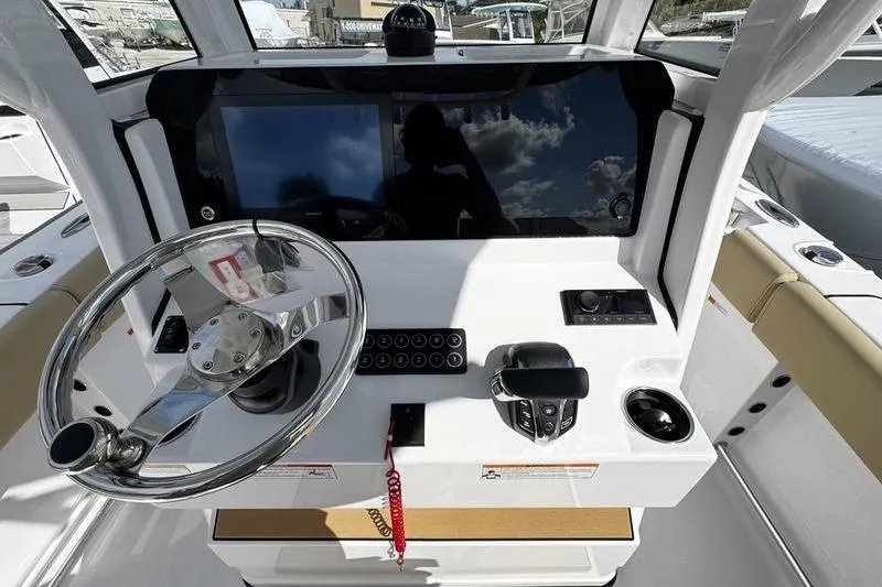 Slide: The Image of 2026 Sportsman Open 232 Center Console dashboard with steering wheel and controls. - 15