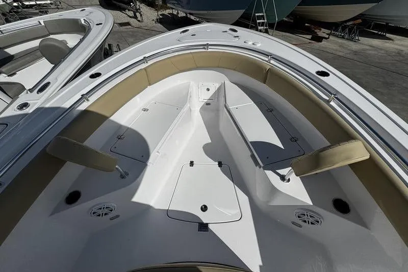 Slide: The Image of 2026 Sportsman Open 232 Center Console boat interior with seating and storage compartments. - 3