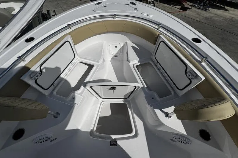 Slide: The Image of 2026 Sportsman Open 232 Center Console boat interior with open storage compartments. - 4