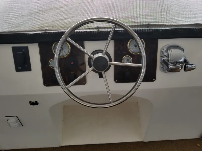 Slide: The Image of Steering console of a 2008 Destination Yachts Cruisin boat. - 26