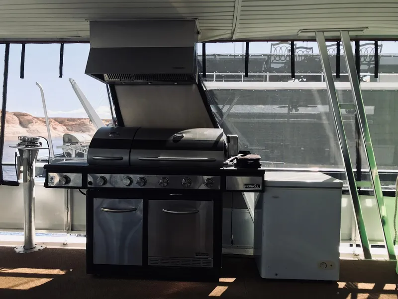 Slide: The Image of Outdoor kitchen on a 2008 Destination Yachts Cruisin houseboat. - 29
