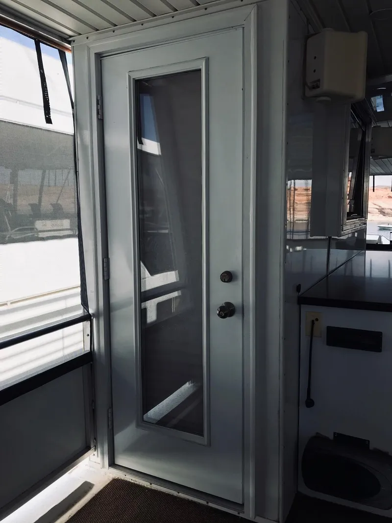 Slide: The Image of Interior view of a 2008 Destination Yachts Cruisin yacht with glass door. - 40