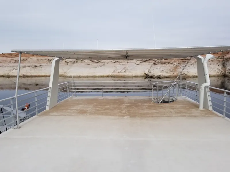 Slide: The Image of 2008 Destination Yachts Cruisin, houseboat with deck and railing. - 42