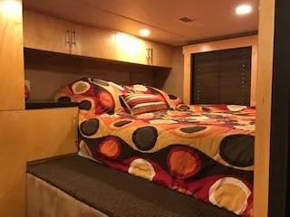 Slide: The Image of Bedroom in a 2008 Destination Yachts Cruisin yacht with colorful bedding. - 16