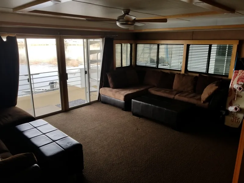 Slide: The Image of Interior of a 2008 Destination Yachts Cruisin yacht with cozy sofas and windows. - 9