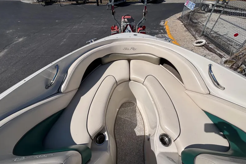 Slide: The Image of 2005 Sea Ray 220 Select boat interior with cushioned seating and cup holders. - 15