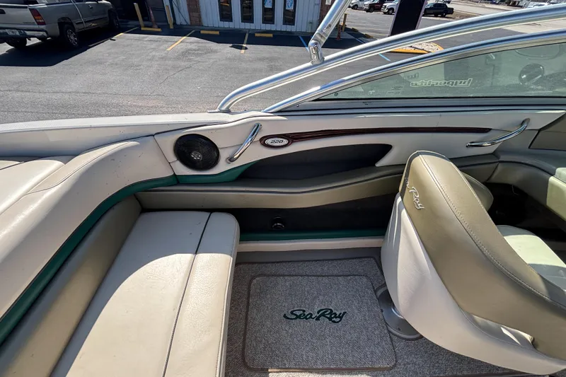 Slide: The Image of 2005 Sea Ray 220 Select boat interior with seating and branded floor mat. - 22