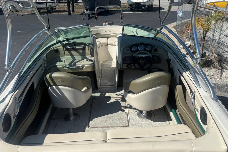 Slide: The Image of 2005 Sea Ray 220 Select boat interior with seating and dashboard view. - 24