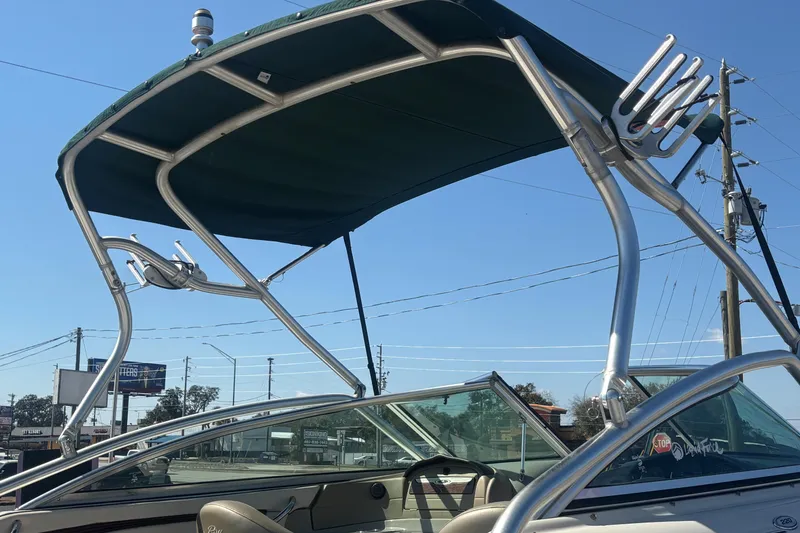 Slide: The Image of 2005 Sea Ray 220 Select boat with a sleek wakeboard tower and canopy. - 25