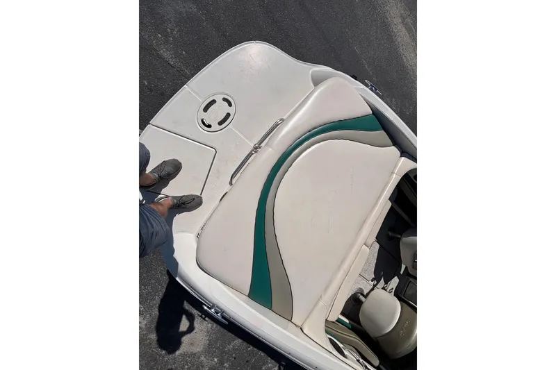 Slide: The Image of 2005 Sea Ray 220 Select boat interior with white and green seating. - 7