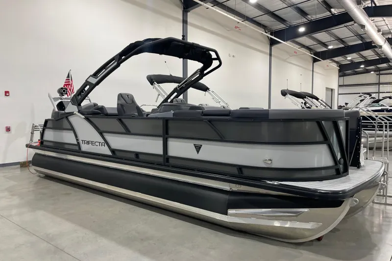 The Image of 2025 Trifecta 23RFSS pontoon boat in showroom, sleek design with modern features. - 0
