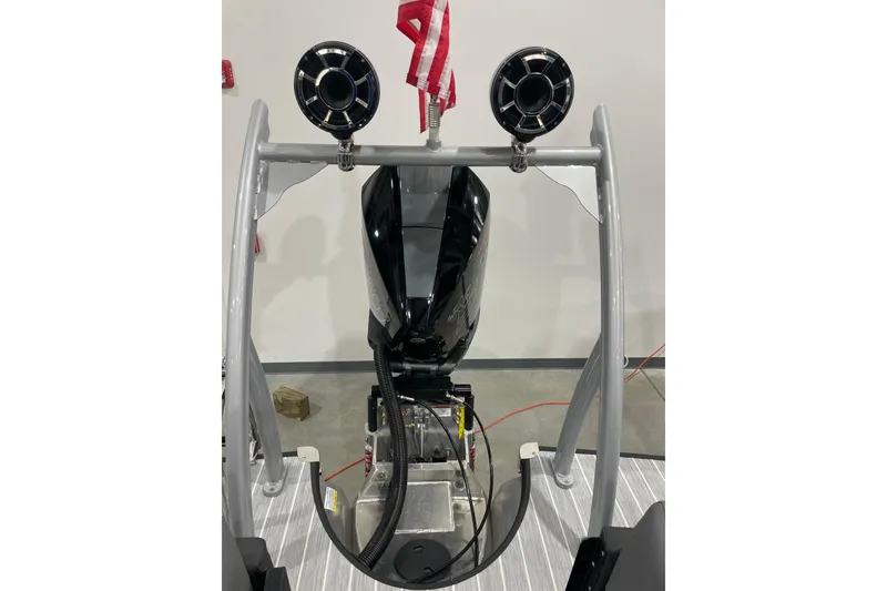 Slide: The Image of 2025 Trifecta 23RFSS boat engine with dual speakers and American flag. - 10