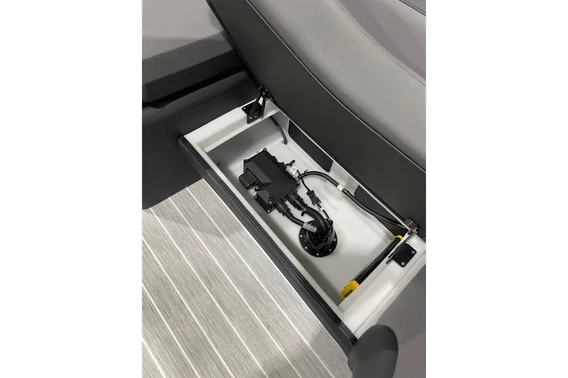 Slide: The Image of Trifecta 23RFSS 2025 seat storage with wiring and components. - 11