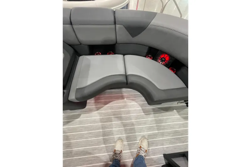 Slide: The Image of 2025 Trifecta 23RFSS boat interior with gray seating and red speakers. - 16