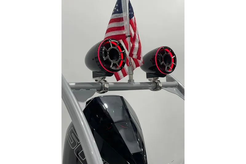 Slide: The Image of 2025 Trifecta 23RFSS boat speakers with American flag on display. - 17