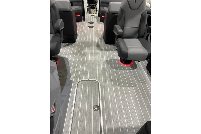 Slide: The Image of 2025 Trifecta 23RFSS boat interior with sleek seating and modern flooring design. - 18