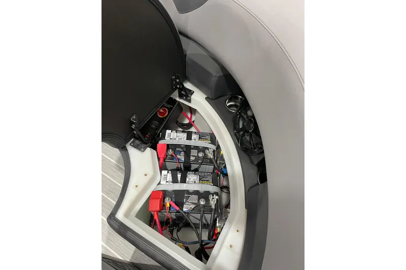 Slide: The Image of 2025 Trifecta 23RFSS boat battery compartment with wiring and components. - 9