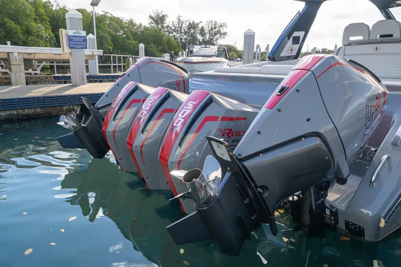 Slide: The Image of 2026 Cigarette 42' Auroris with five powerful outboard engines in a workshop setting. - 10