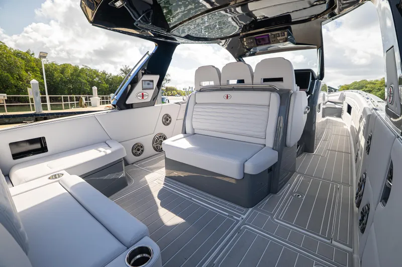 Slide: The Image of 2026 Cigarette 42' Auroris luxury boat interior with sleek seating and modern design. - 2