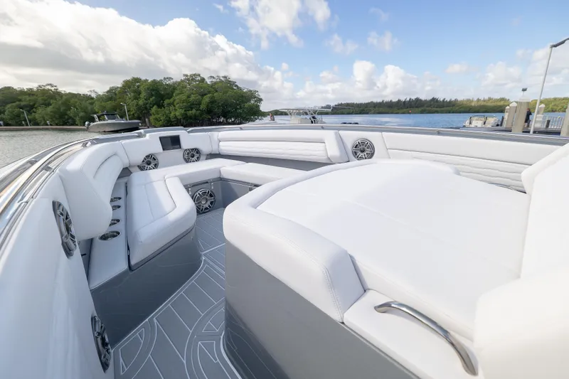 Slide: The Image of Luxurious 2026 Cigarette 42' Auroris boat interior with white seating and scenic water view. - 7