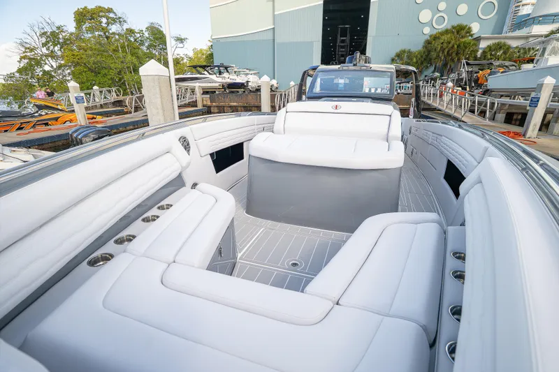 Slide: The Image of Luxurious 2026 Cigarette 42' Auroris boat with spacious white seating at a marina. - 9