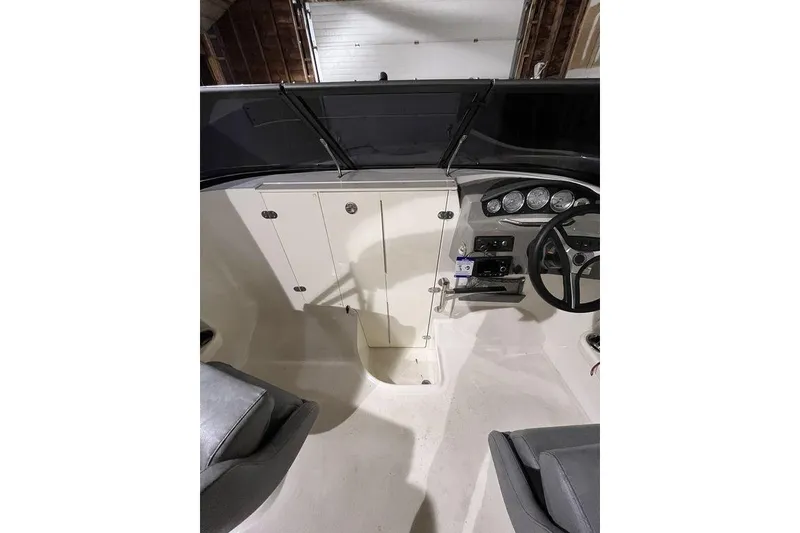 Slide: The Image of 2020 Stingray 208 CR boat interior with steering wheel and dashboard controls. - 14
