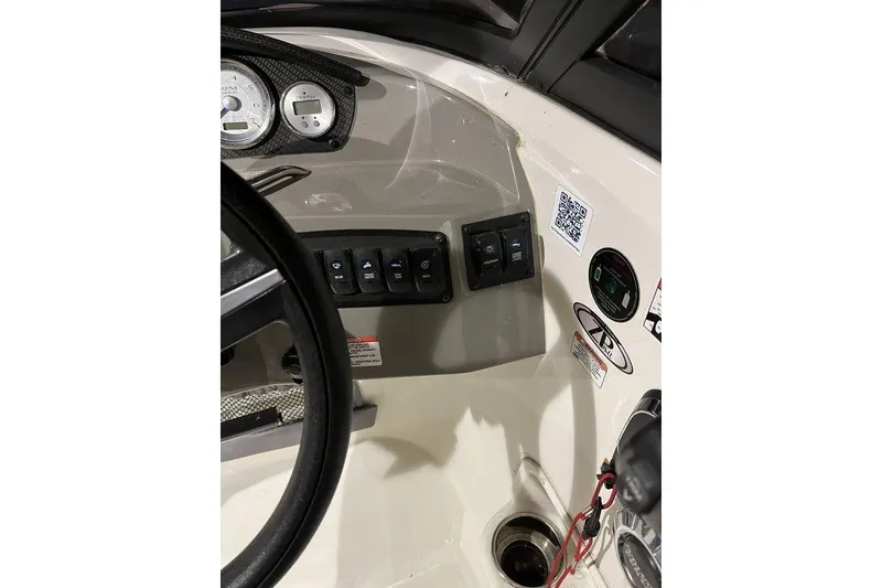 Slide: The Image of Dashboard of 2020 Stingray 208 CR boat with controls and gauges. - 17