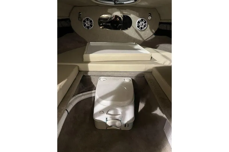 Slide: The Image of Interior of 2020 Stingray 208 CR boat with seating and storage area. - 21