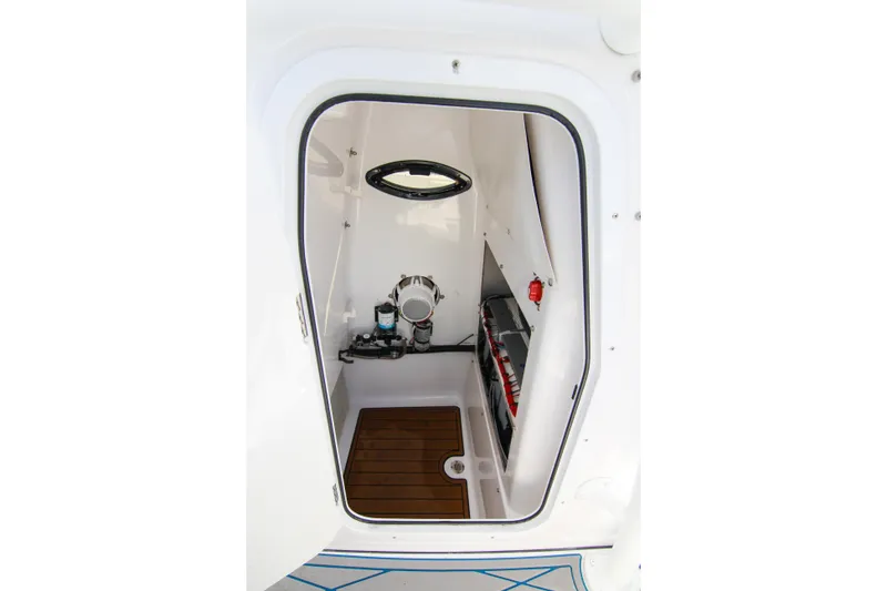 Slide: The Image of Interior view of 2018 Sportsman Heritage 241 Center Console boat cabin. - 17