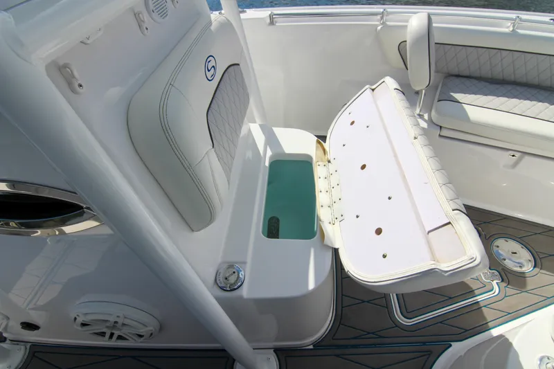 Slide: The Image of 2018 Sportsman Heritage 241 Center Console interior with open storage compartment. - 28