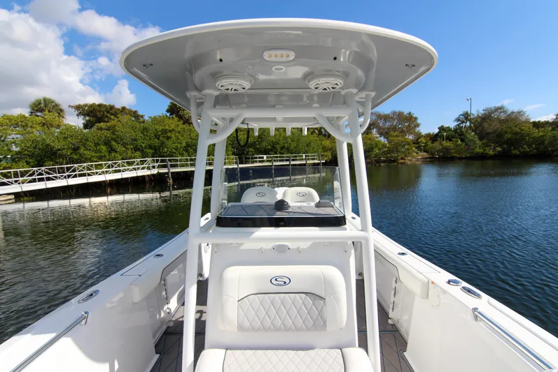 Slide: The Image of 2018 Sportsman Heritage 241 Center Console boat on calm water, featuring sleek design and modern amenities. - 32