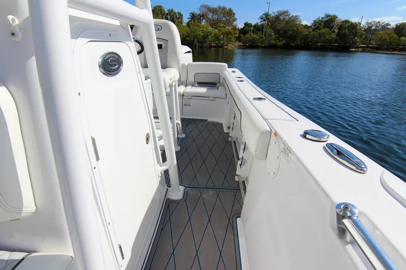 Slide: The Image of 2018 Sportsman Heritage 241 Center Console boat interior by the water. - 35