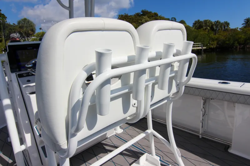 Slide: The Image of 2018 Sportsman Heritage 241 Center Console boat with rod holders and seating. - 45