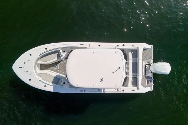 Slide: The Image of Overhead view of 2018 Sportsman Heritage 241 Center Console boat on water. - 7